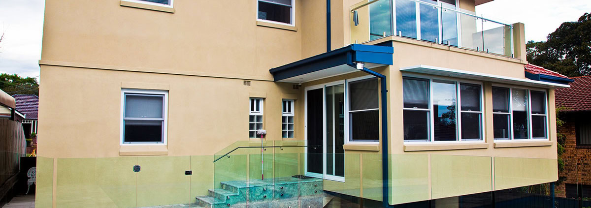 Residential house with pool, balcony, and large windows in Sydney.